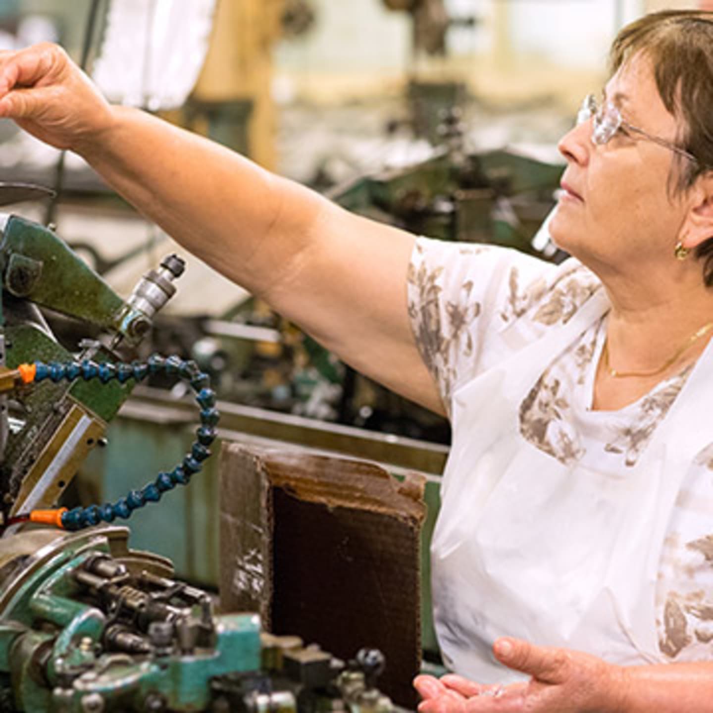 Woman working in watch factory